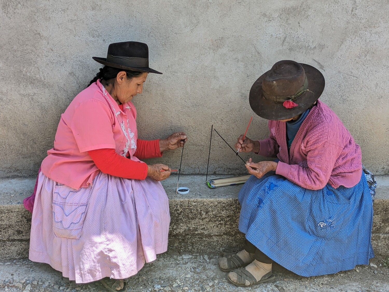 women-painting-sticks.jpg